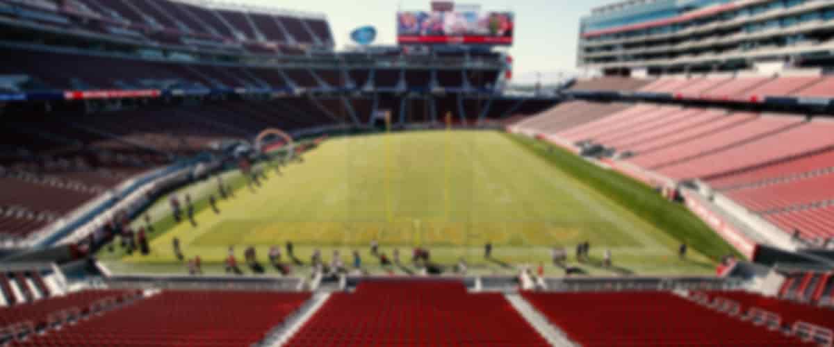 Runners dot the field of Levi's Stadium as they warm up for the Golden Heart Run.